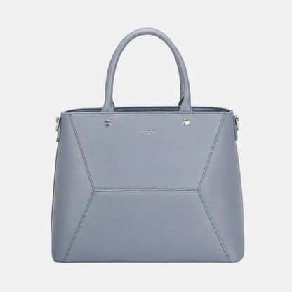 Modern grey leather handbag with geometric panels, double handles, and silver accents