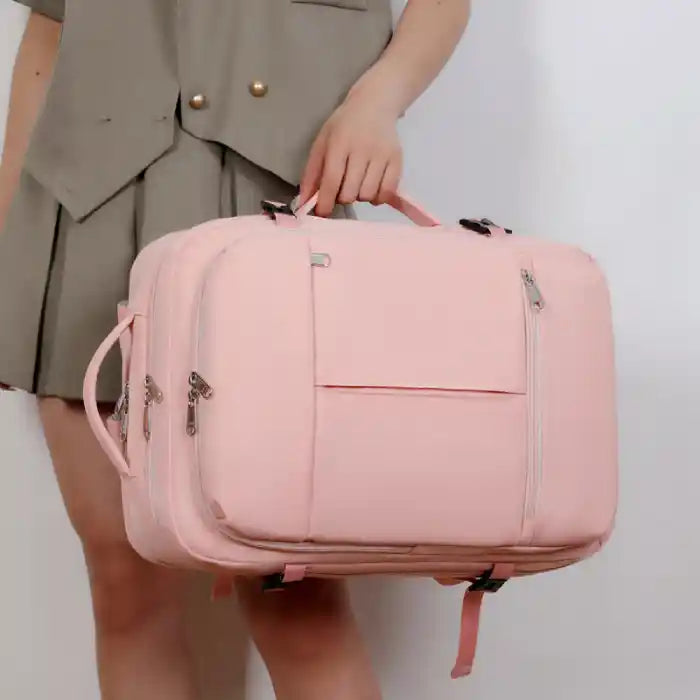 Large capacity stylish pink laptop backpack with top handle, perfect for business and travel versatility.