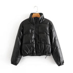 Stylish puffer jacket in black faux leather shown from front with high collar and snap buttons