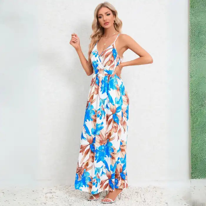 Summer dress with blue and brown floral print on white background, featuring v-neck design and airy maxi length for hot weather