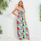 Summer dress in elegant palm leaf print featuring blue and green tropical pattern with v-neck wrap design and ankle-length hemline