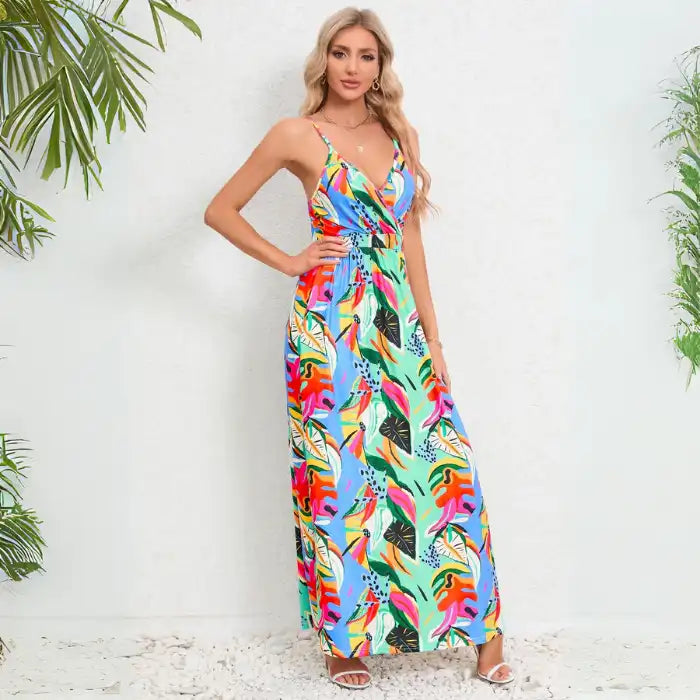 Summer dress in elegant palm leaf print featuring blue and green tropical pattern with v-neck wrap design and ankle-length hemline