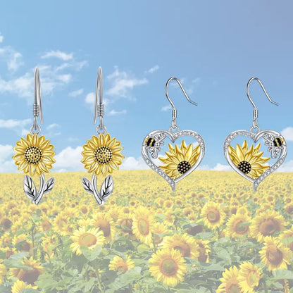 Sunflower-themed earrings displayed against a vivid sunflower field backdrop for nature-inspired jewelry fans.