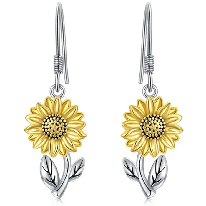 Yellow sunflower dangle earrings with silver leaf details, ideal for floral-inspired jewelry collections.