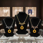 sunflower pendant necklace for women shown in gold silver and rose gold on jewelry stands creating a premium floral accessory display