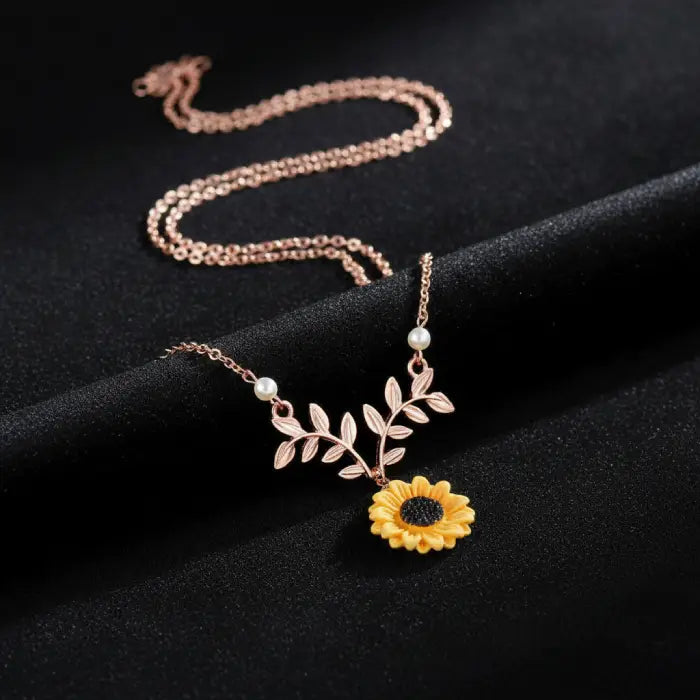 sunflower pendant necklace for women in rose gold displayed on a black background highlighting elegant floral details and feminine charm