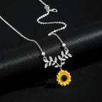 sunflower pendant necklace for women shown in silver with bright floral detailing on black for a refined elegant feminine jewelry style