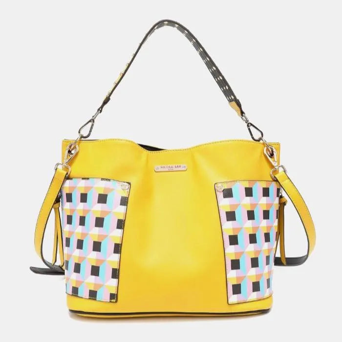 Modern yellow leather purse with geometric print accents, branded metal plate, and convertible carrying options