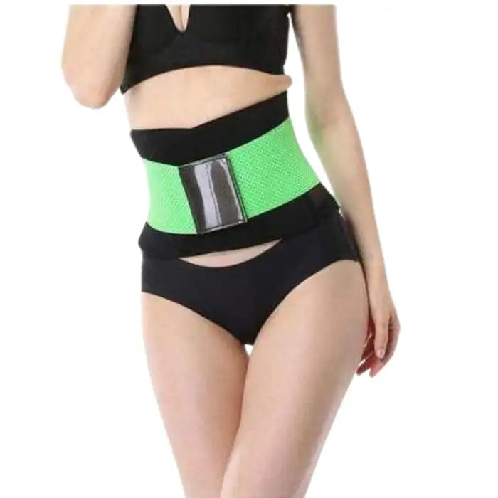 Green sweat waist trimmer worn high-rise style over hips for enhanced midsection shaping.
