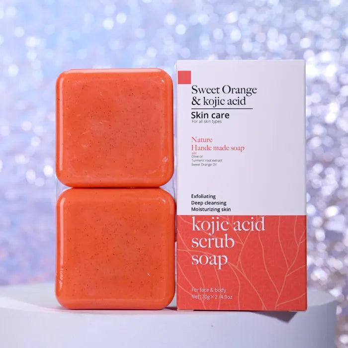 Sweet orange and kojic acid scrub soap against sparkling bokeh background.