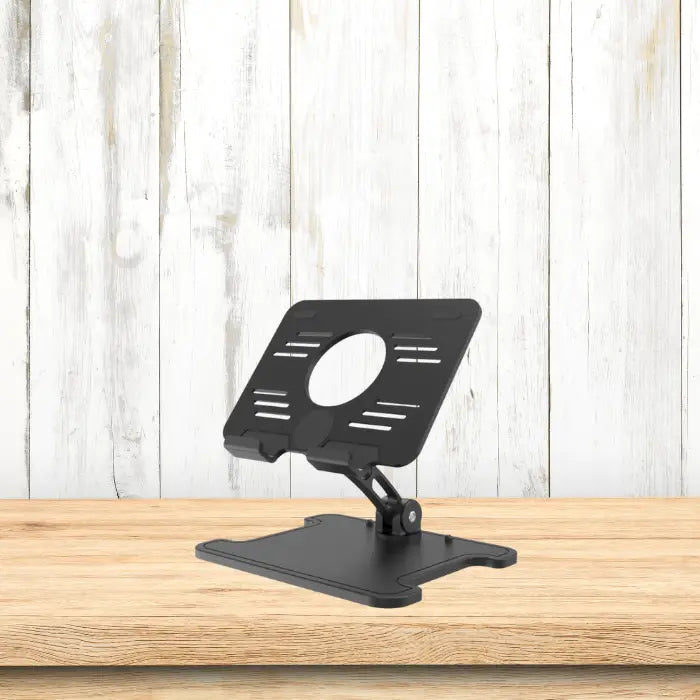 Tablet stand on wooden table with white rustic panel background, ideal for product display or ecommerce.