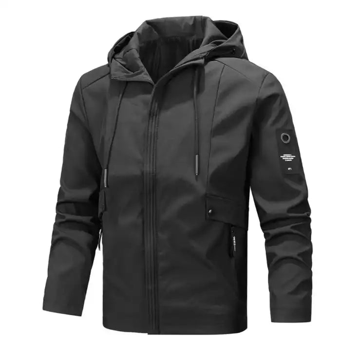 Tactical hooded jacket with zippered pockets in black, showcasing multiple pockets and sleeve patch detailing.