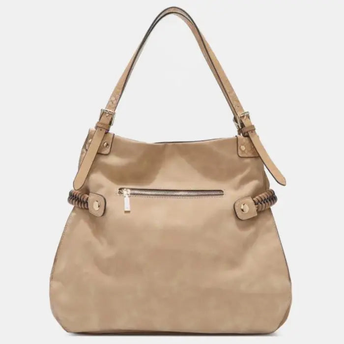 Back view of tan bag with zipper pocket and braided straps, offering practical storage for essentials.