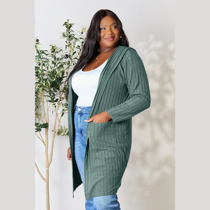 Plus size forest green ribbed cardigan styled with white tank top and blue jeans for comfortable everyday fashion