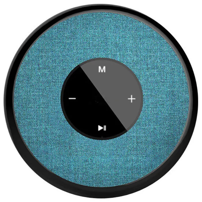 Circular smart speaker with teal fabric cover and black control panel featuring volume, play/pause, and mode buttons