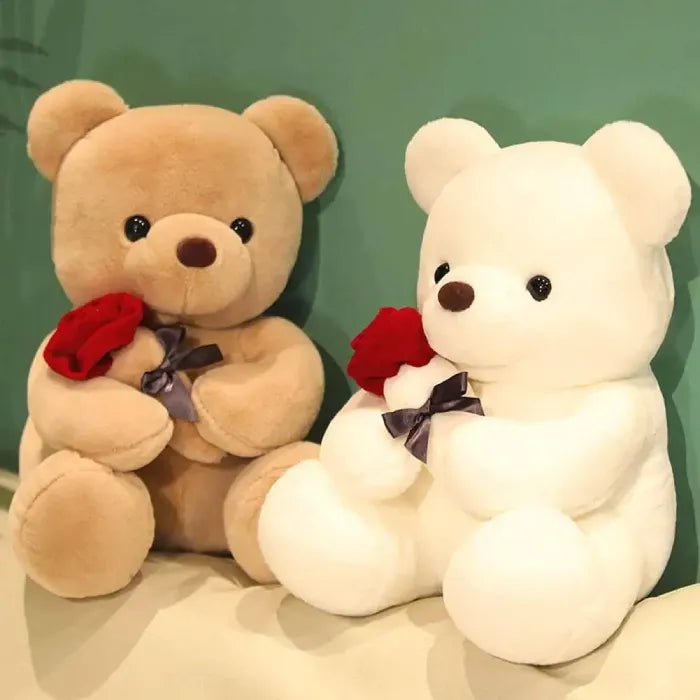 Romantic scene with two teddy bears, brown and white, with red roses.