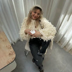 Textured loop knit cardigan jacket in beige from above, highlighting the soft looped fringe and cozy button front.