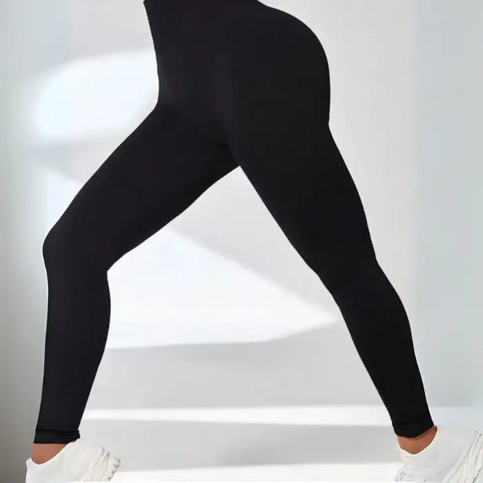 Thermal Yoga Leggings shown in side stretch pose with contour fit and smooth seamless finish.