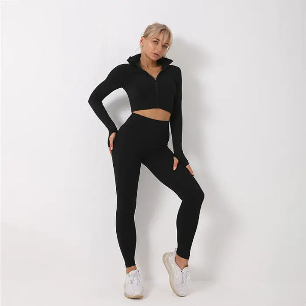 Three-piece seamless yoga set for women in solid black design with cropped jacket and ankle-length leggings.