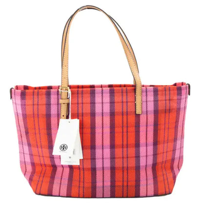 Back view of Tory Burch plaid tote with leather straps and attached brand tag.