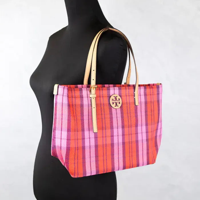 Tory Burch plaid tote displayed on mannequin, highlighting size and style.