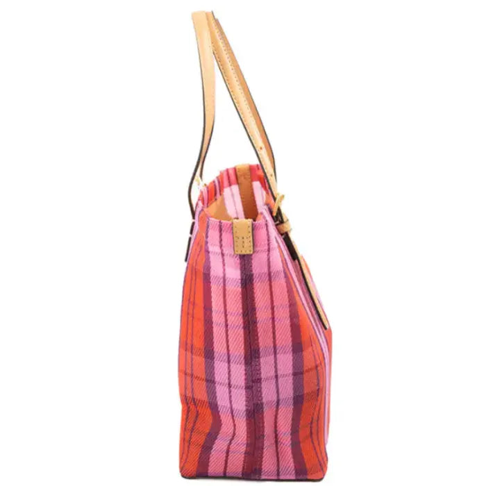 Side profile of Tory Burch plaid tote showing leather details and structured silhouette.