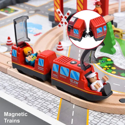 Red magnetic toy train running on a track with close-up of magnetic coupling and miniature scenery.