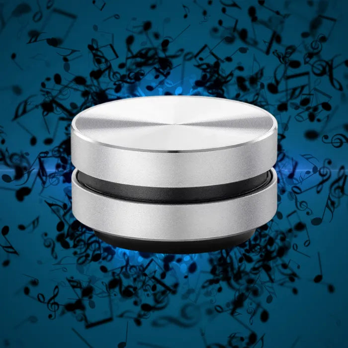 Mini portable speaker transforming any surface like cardboard, wood, car dashboard, and glass.