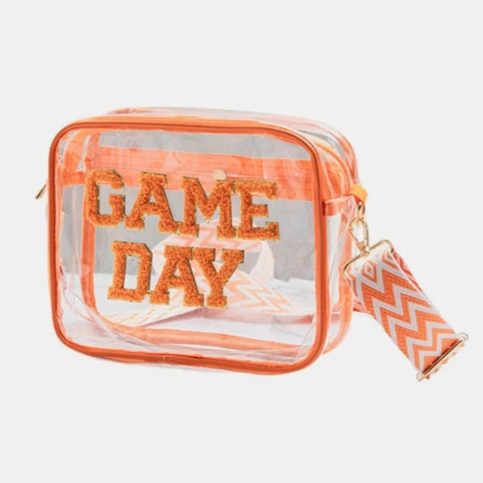 Clear stadium bag with orange glitter Game Day text and geometric pattern shoulder strap for sporting events