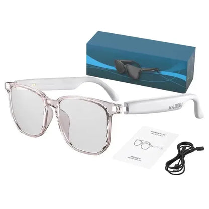 Transparent smart glasses with white frame, displayed with box and cable.