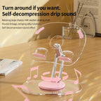 Transparent tablet stand with drip sound feature and rotating base for stable desktop device positioning.