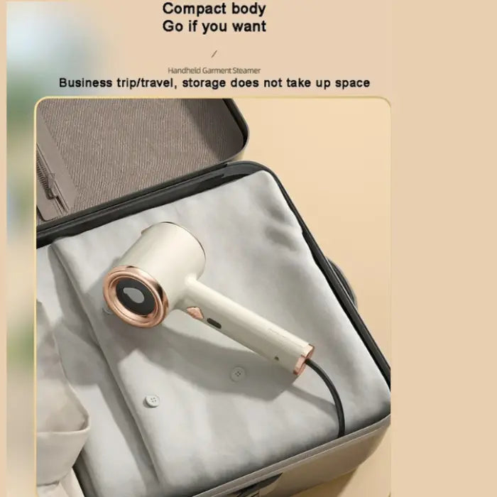 Travel steamer with compact design shown packed in suitcase for easy business travel use.