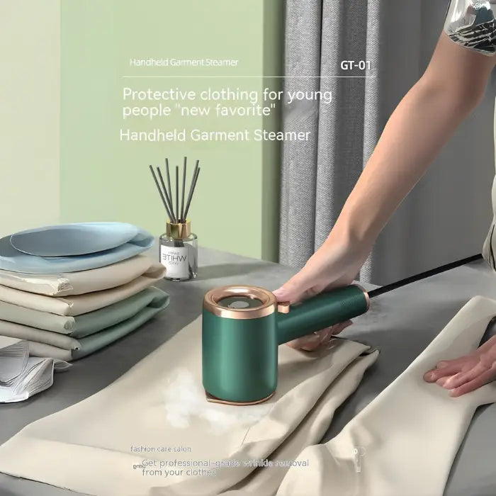  Travel steamer used on beige clothes, stacked laundry beside green steamer in hand.