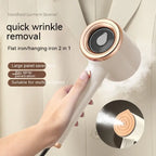  Travel steamer releasing steam onto jacket using 2-in-1 hanging and flat iron mode.

