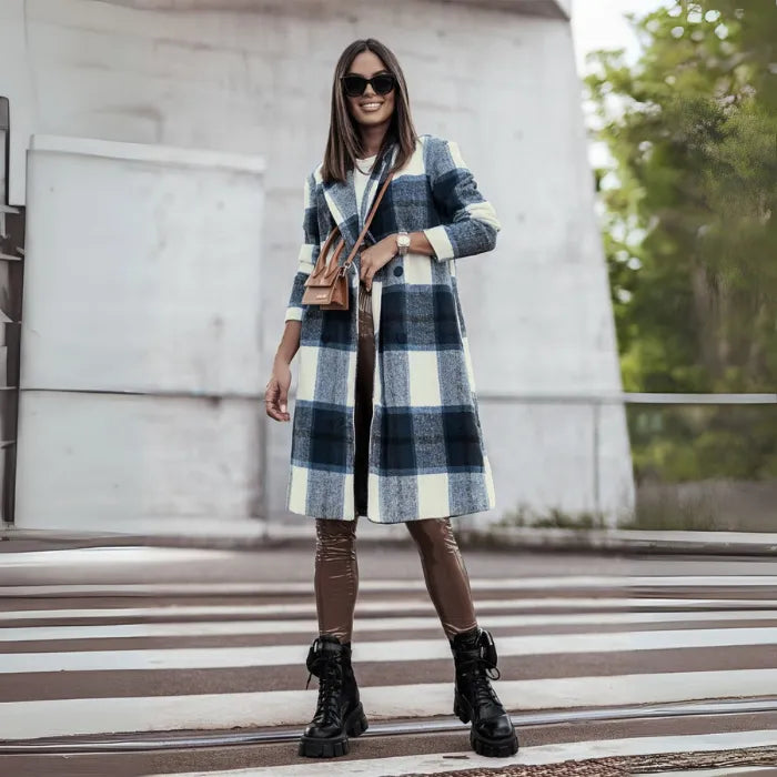 Long plaid wool coat in blue and cream with brown pants and combat boots, styled for urban street fashion
