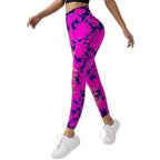 Tummy Control Yoga Pants in pink with black tie-dye and side slits, shown in side walking pose.