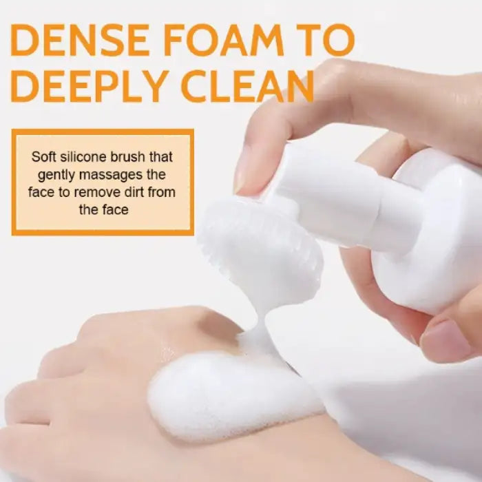 Turmeric skin cleanser applied with dense foam using a soft silicone facial brush.