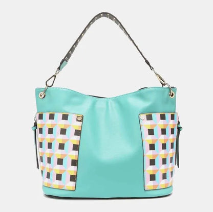 Modern turquoise hobo-style handbag with multicolored geometric print pockets and polka dot shoulder strap