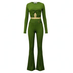 two piece set in green featuring ribbed fabric, long sleeve crop top and flared pants with gold hardware detail