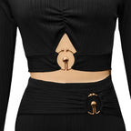 two piece set black ribbed crop top and waist detail featuring gold hardware for a sleek modern silhouette