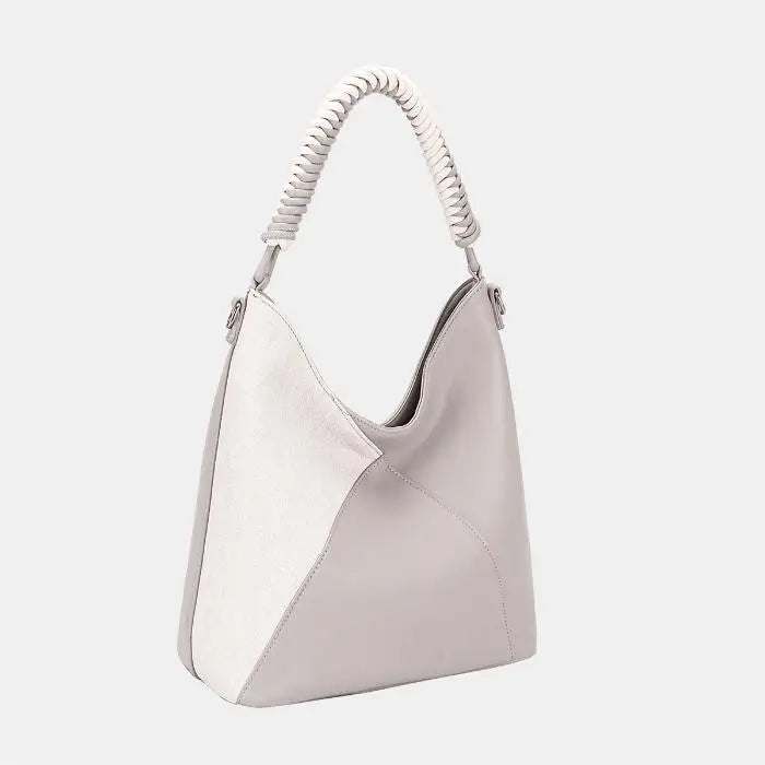 Elegant two-tone hobo bag with braided handle, featuring light gray leather and cream suede panels