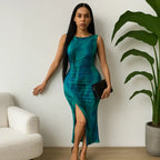 Green-blue tye dye form-fitting dress featuring a sleeveless cut, side slit, and elegant ruched design.