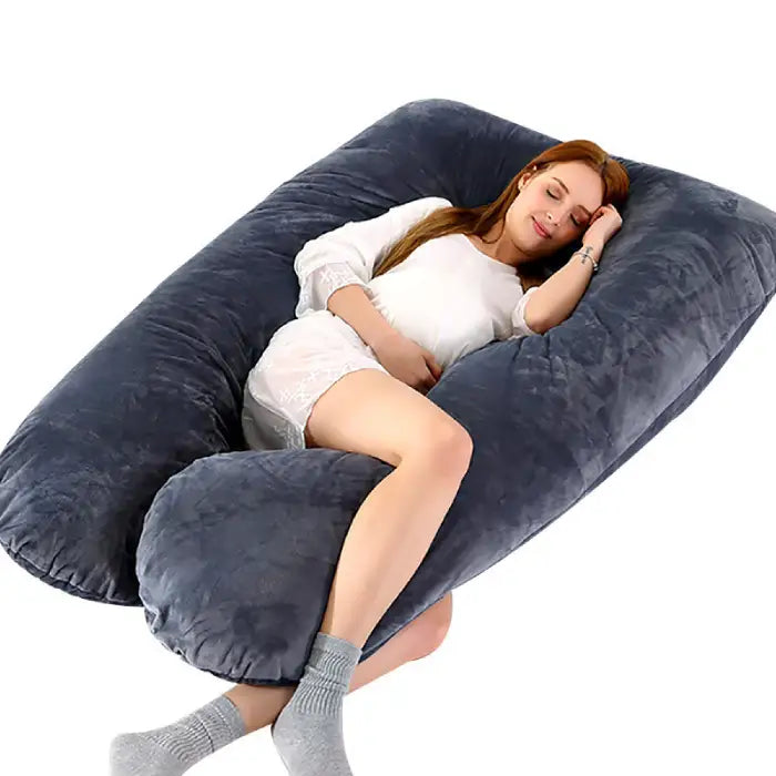 U-shape pregnancy pillow in dark gray providing cozy full-body support for restful side sleeping.