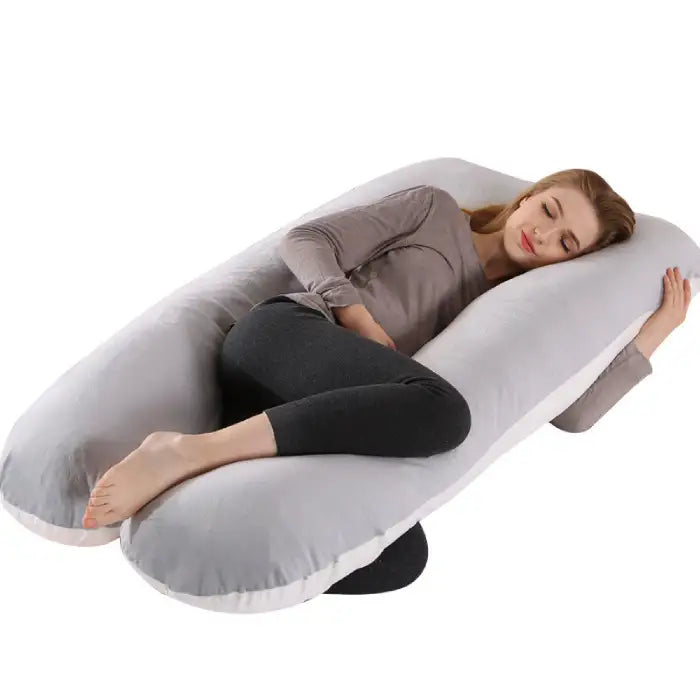 Soft white U-shape pregnancy pillow with ergonomic design for maternity support and restful sleep.