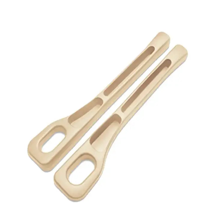 Pair of beige plastic car seat gap fillers featuring ergonomic design with storage slots