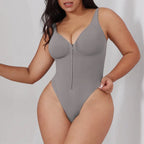 V neck shapewear bodysuit in grey shown at an angle, highlighting sculpting fit, soft compression zones, and smooth support for daily shaping