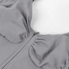 V neck shapewear bodysuit grey bust closeup showcasing ruched shaping details, zipper design, and supportive compression structure