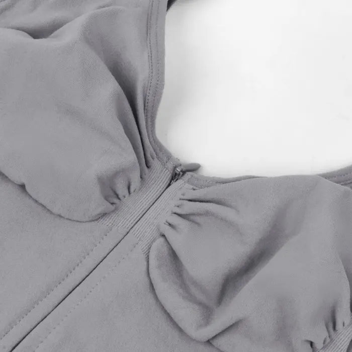 V neck shapewear bodysuit grey bust closeup showcasing ruched shaping details, zipper design, and supportive compression structure