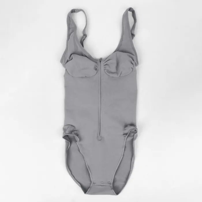 V neck shapewear bodysuit in grey shown flat on a white background, highlighting zipper front and soft sculpting fabric for supportive shaping wear