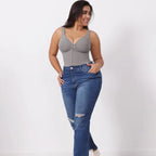 V neck shapewear bodysuit in grey paired with jeans, showing smooth shaping fit and supportive compression ideal for everyday casual outfits